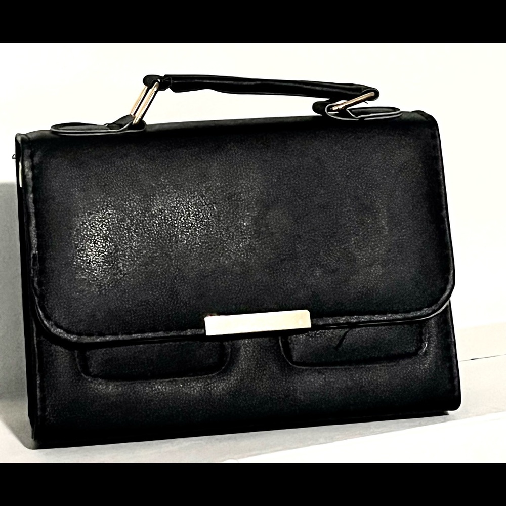 black handbag has its strap